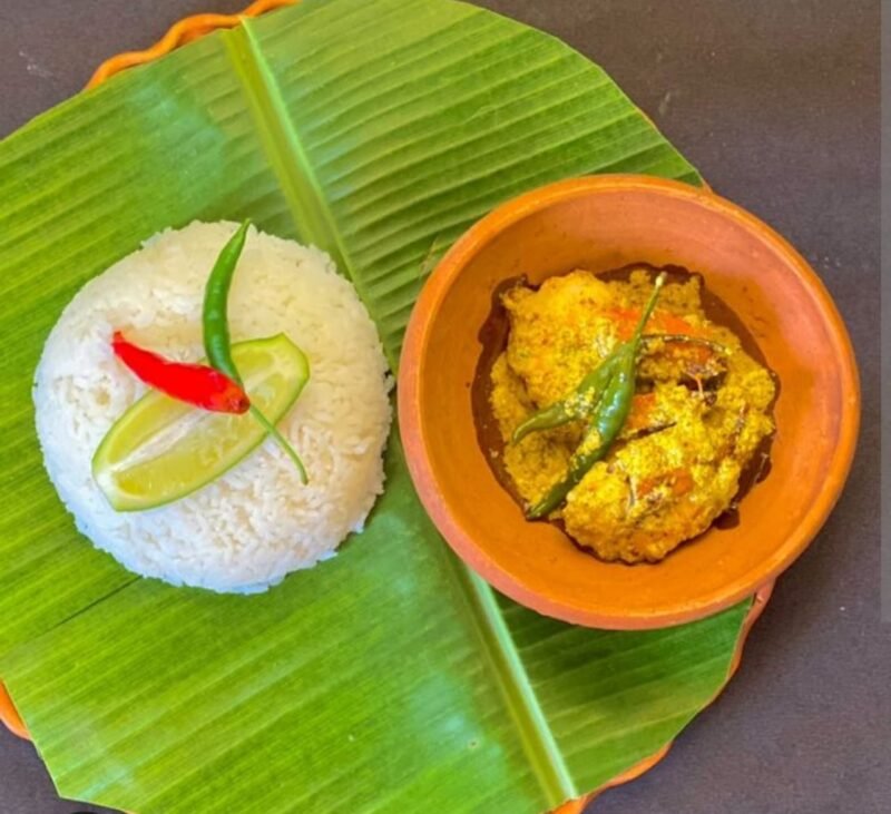 Chingri Shorshe Bhapa (Prawns with coconut and mustard) with steamed basmati rice