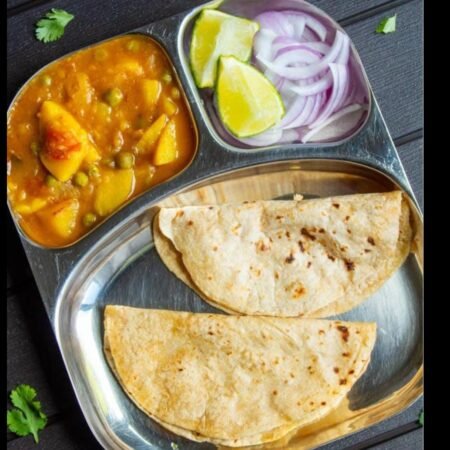 Veg Premium Thali (Aaloo Dum Matar, Rice, Daal Tadka, 4 ghee roti)